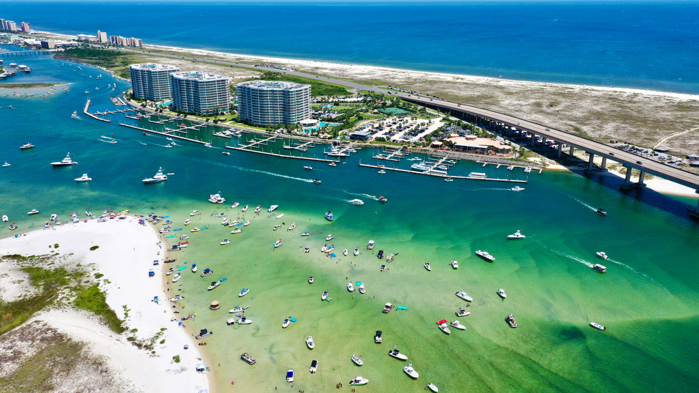 aerial photo of bay and ocean with boats in the water 