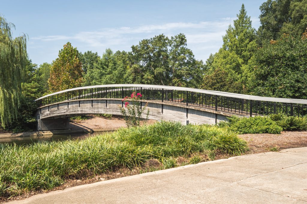 The oldest bridge, established in 1887, stands in Pullen Park, one of the best things to do in North Carolina