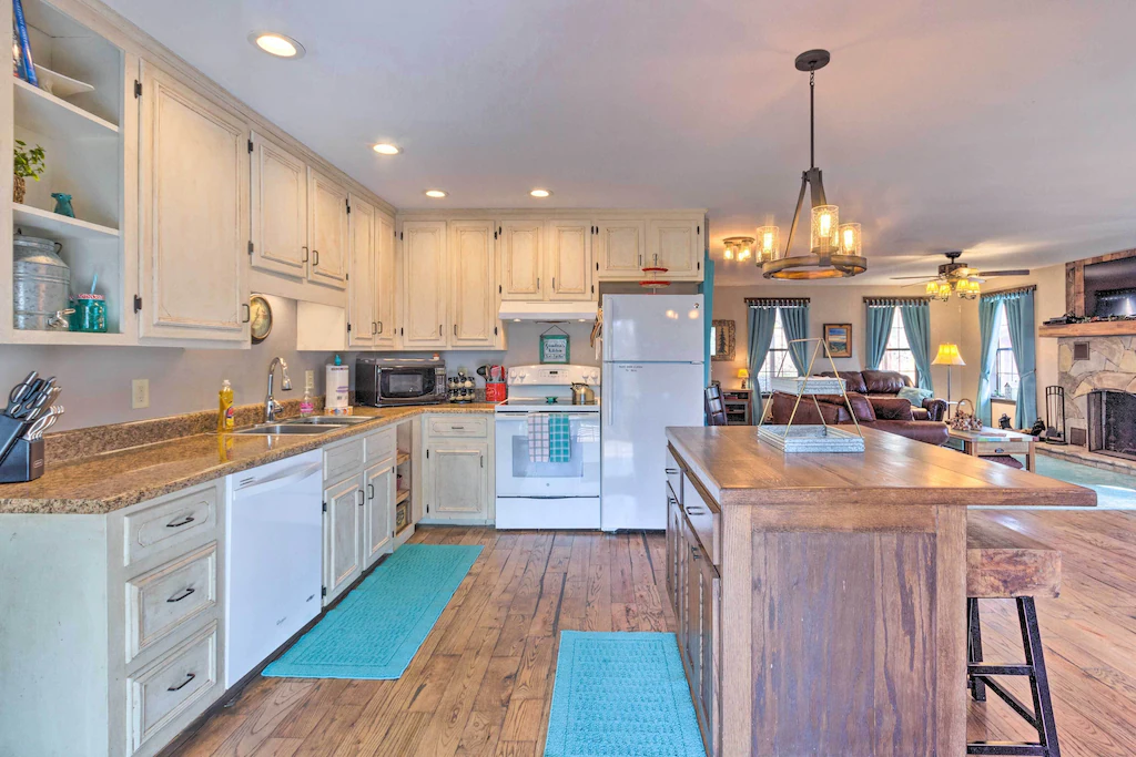 Joshua's lodge, a North Carolina airbnb, offers sleeping quarters for up to 16 guests demonstrated by this incredibly large kitchen and living space