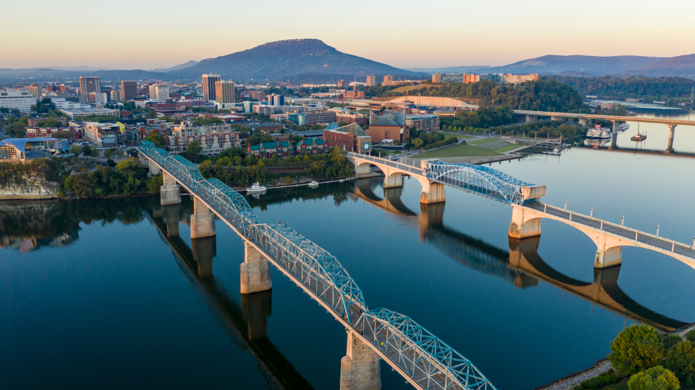 arial photo of city, river, and several bridges crossing the river