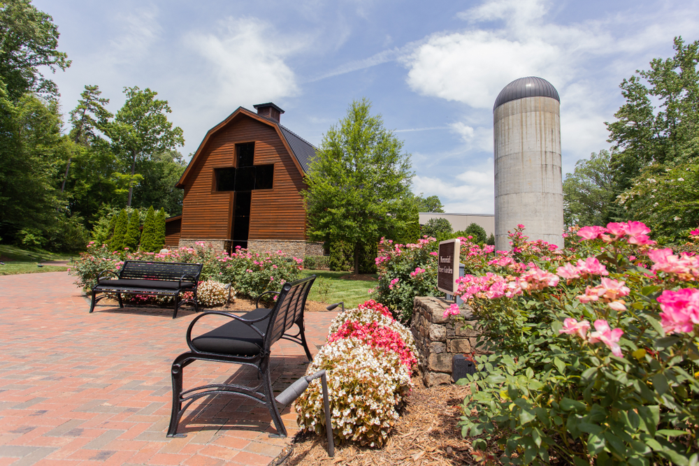 Exterior of the Billy Graham Library amidst a garden of flowers, one of the best things to do in Charlotte.