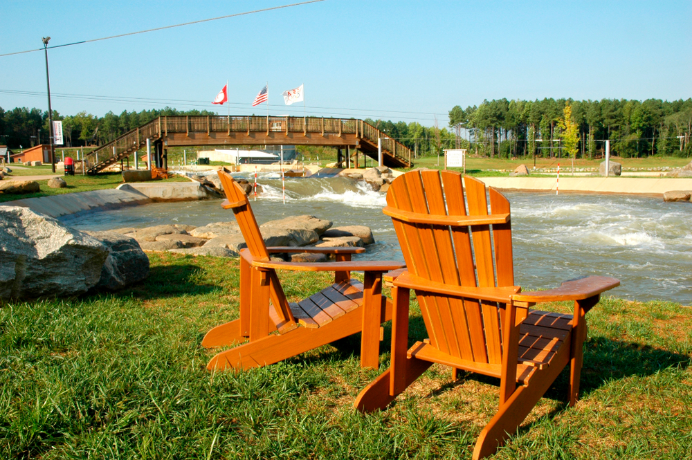 Two chairs overlooking the rapids at Whitewater Center, one of the best things to do in Charlotte.