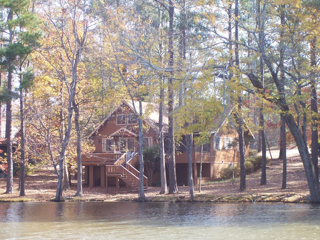 One of the prettiest cabins in the south, the Spacious Lakefront Chalet sits right on the water.
