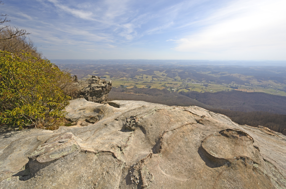 View from a ledge overlooking the forests and houses far below at Cumberland Gap.