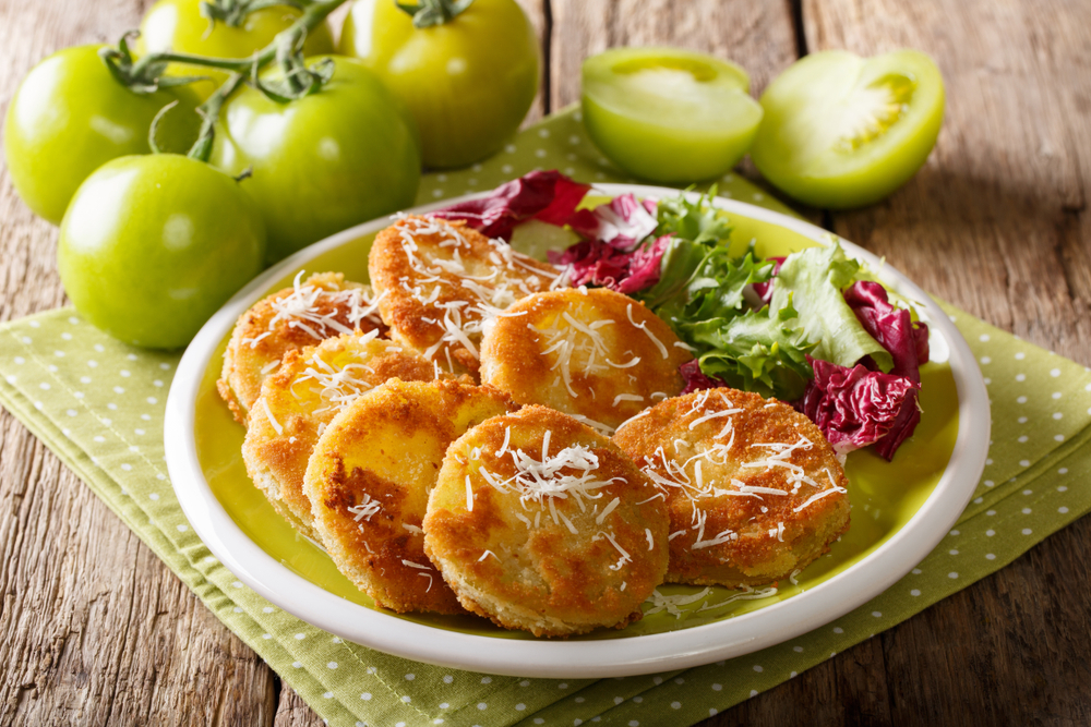 photo of fried green tomatoes with white cheese sprinkled on top 