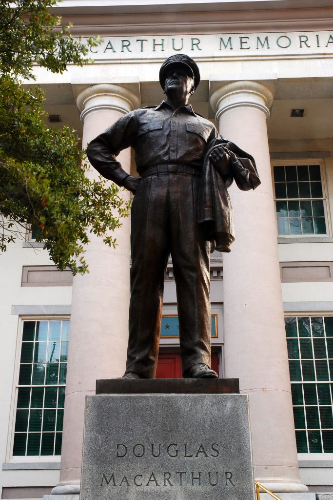 A robust statue of General Douglas MacArthur stands outside of his memorial, one of the best things to do in Norfolk VA