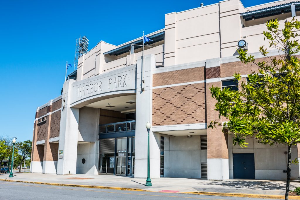 The exterior of Harbor Park welcomes guests to attend minor league baseball games.