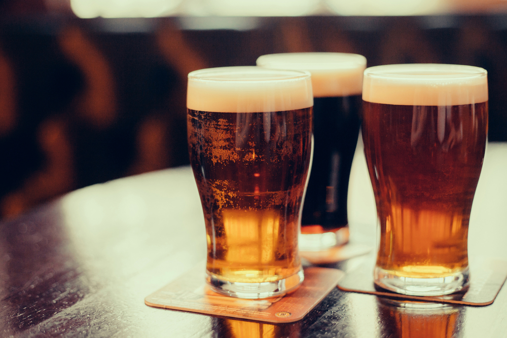 Three beers on a table, representing Arsenal Tap Room and Kitchen, one of the best restaurants in Augusta.