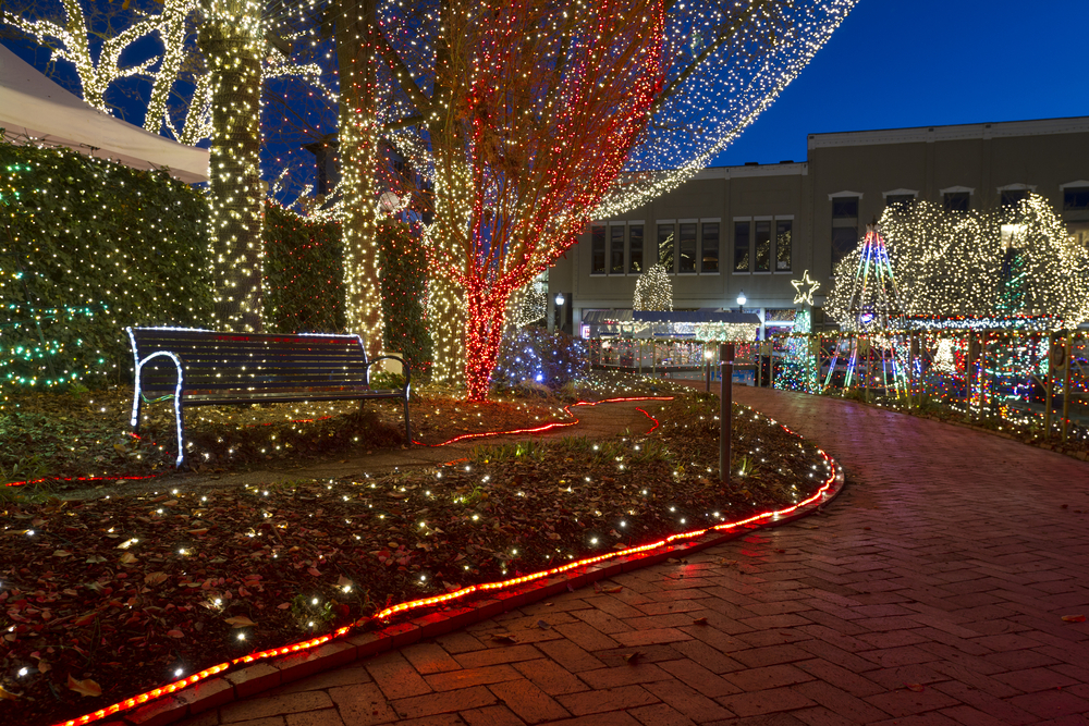 A brick path in a the city center in Fayetteville, Arkansas. All throughout the square in the city center there are thousands of different colored string lights covering every surface but the brick path. A great place to see lights for Christmas in the south. 