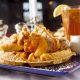a chicken and waffle with sweet tea
