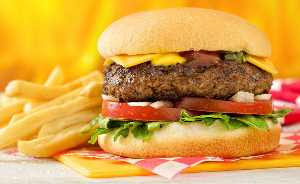 cheeseburger and french fries on a checkered paper