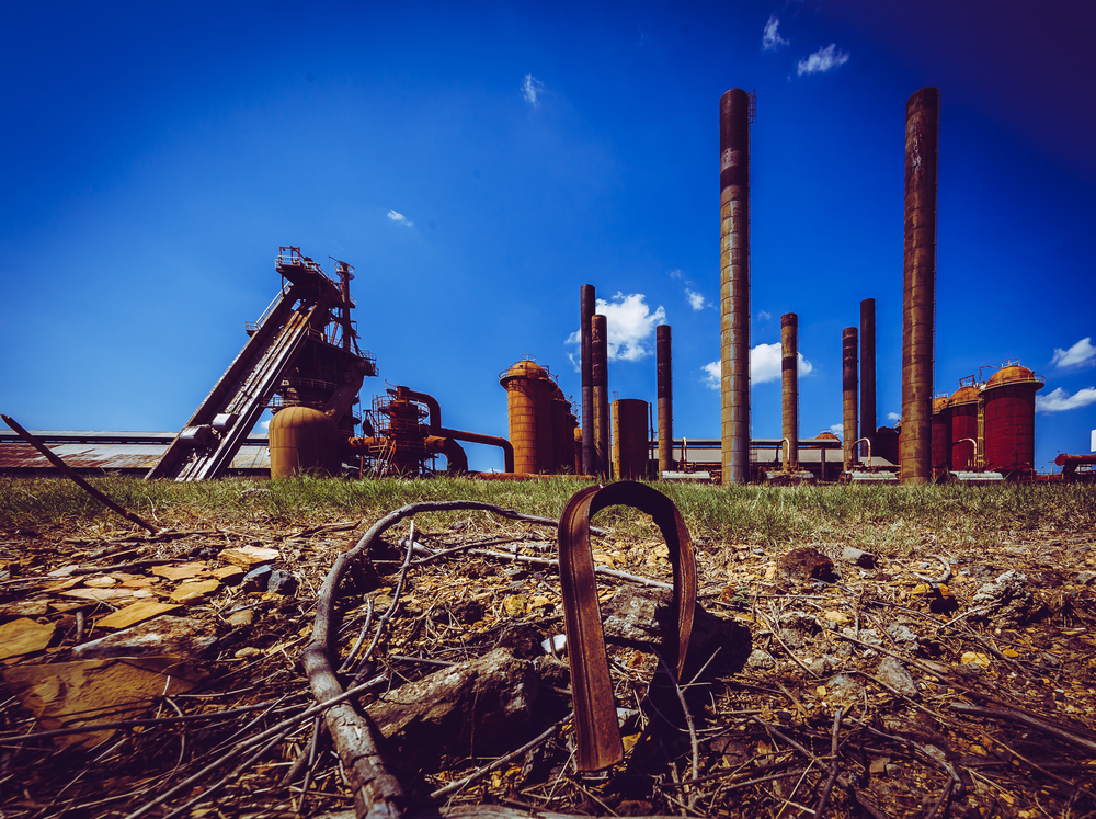 Metal junk with sloss furnaces and blue sky in the background.