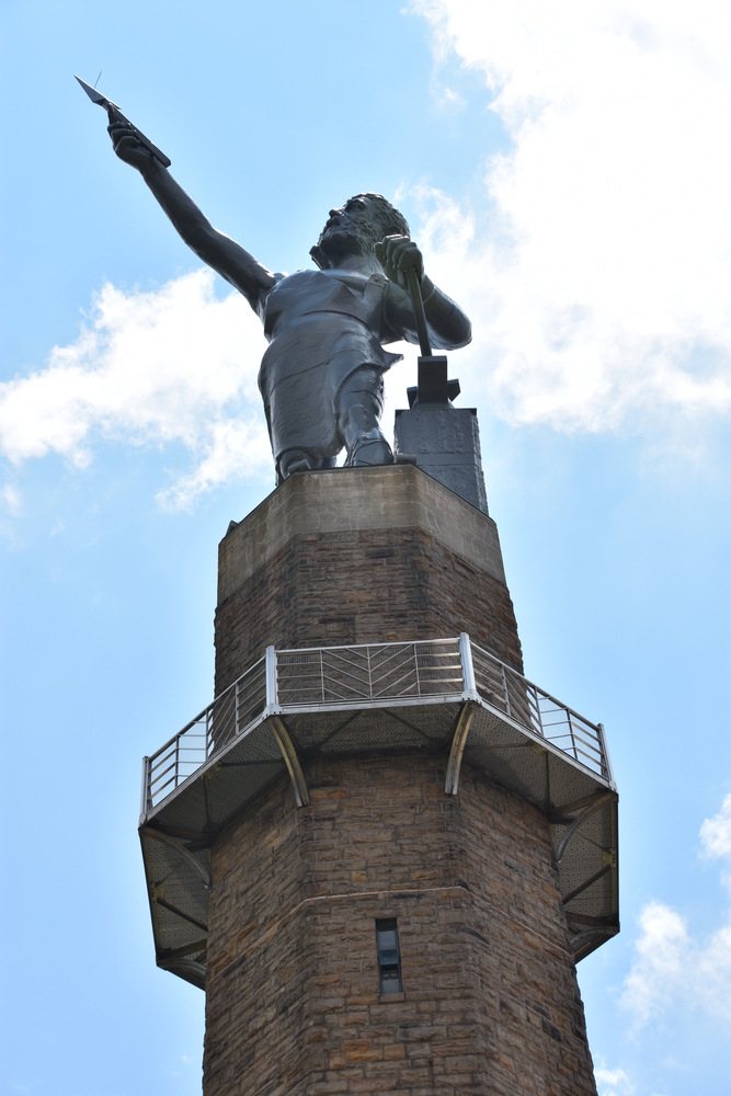 Close up of the vulcan state at vulcan park in birmingham with a blue sky and some clouds.