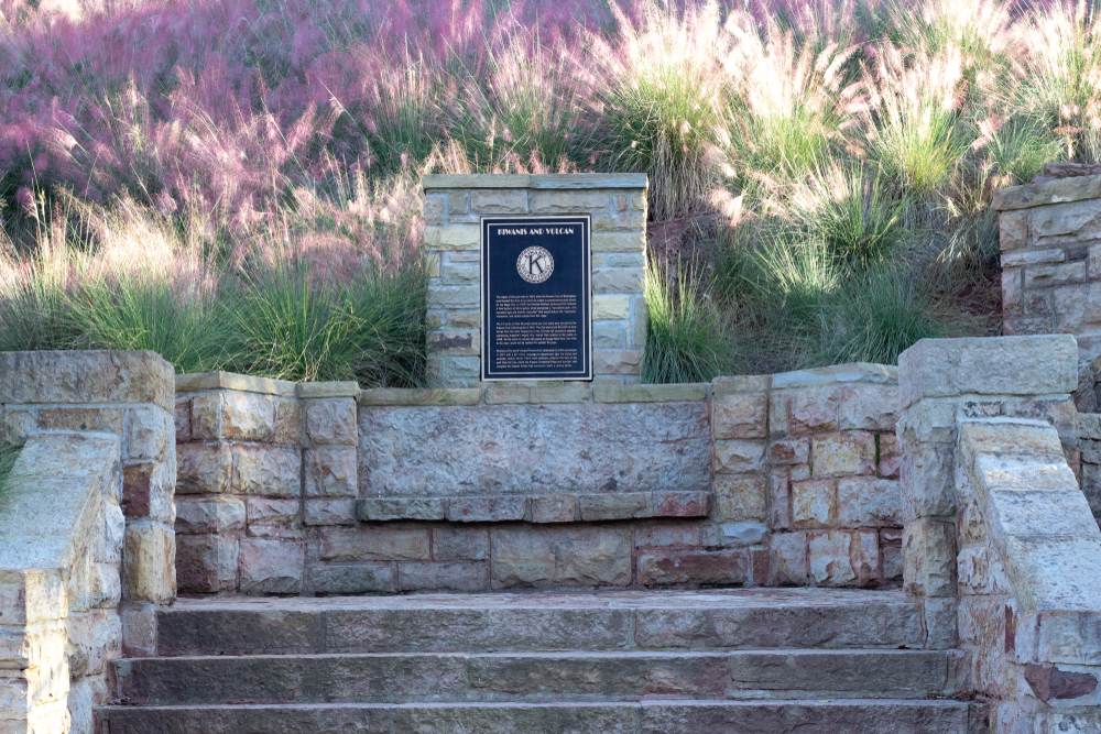 Kiwanis Club plaque at Vulcan Park surrounded by pink heather, best things to do in Birmingham.
