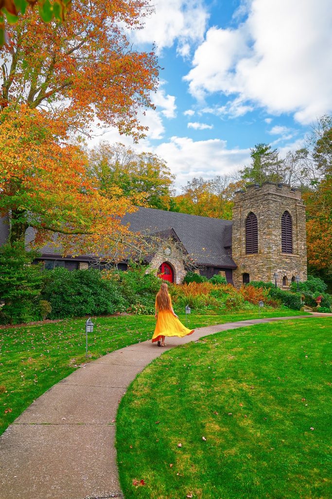 Girl in yellow dress walking towards St. Mary of the Hills Episcopal Church.