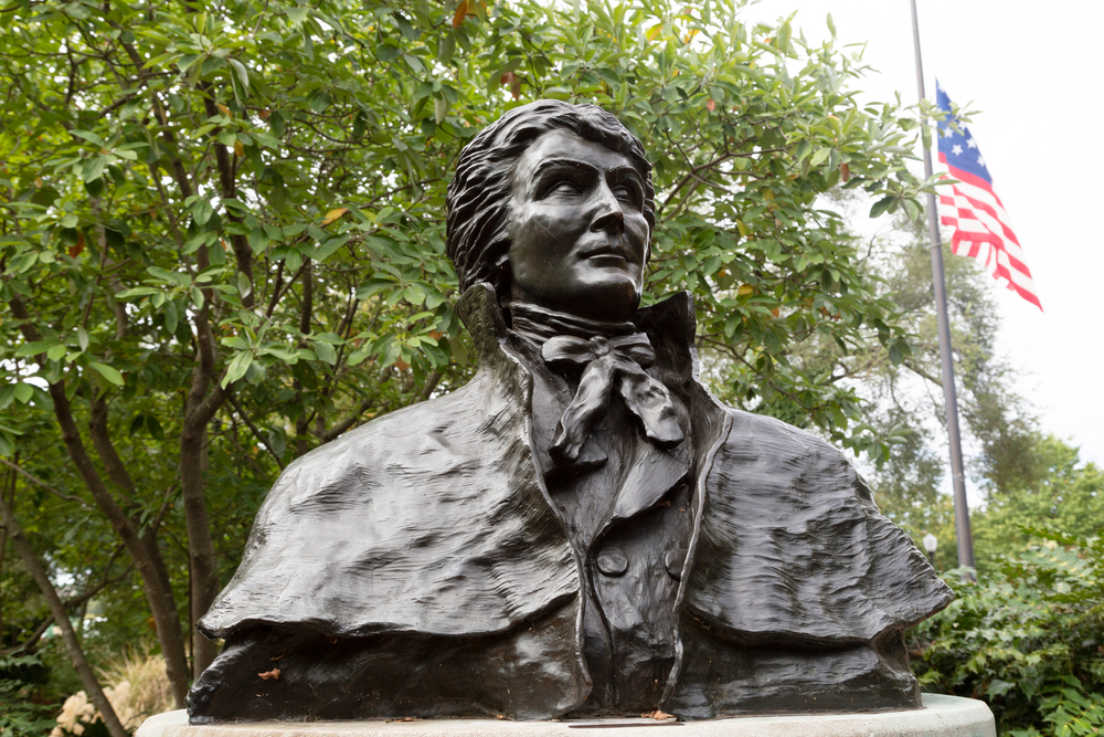 The Francis Scott Key Memorial with the flag in the background.