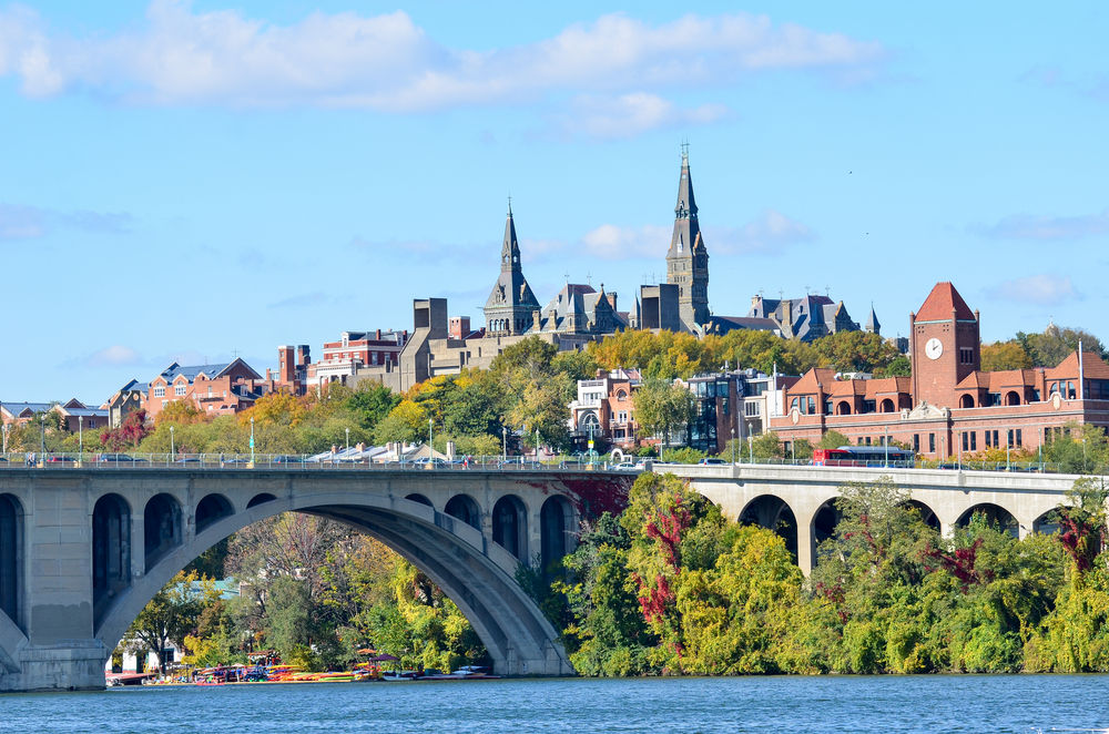 View of Georgetown University over the river and a bridge. Visiting here is one of the best things to do in Georgetown 