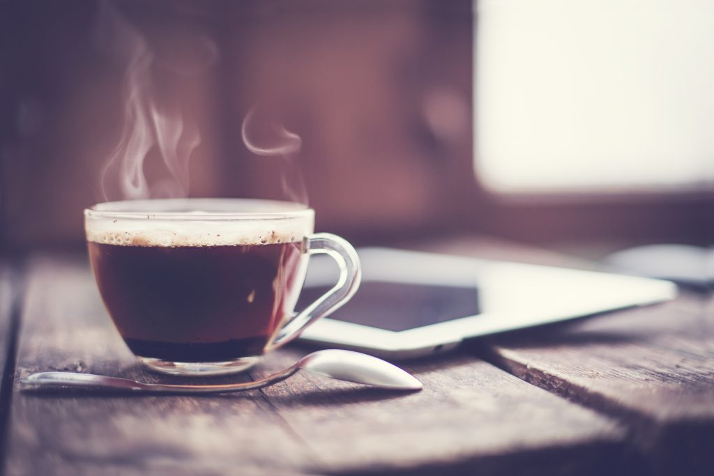 A cup of coffee on a table in an article about coffee in Asheville