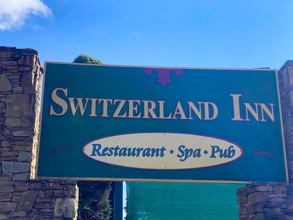 sign for the switzerland inn one of the places to eat in Little Switzerland