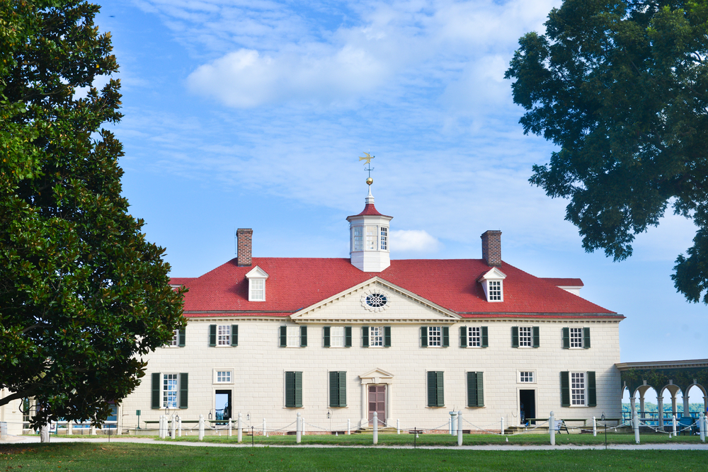 The exterior of Mount Vernon with trees on either side.