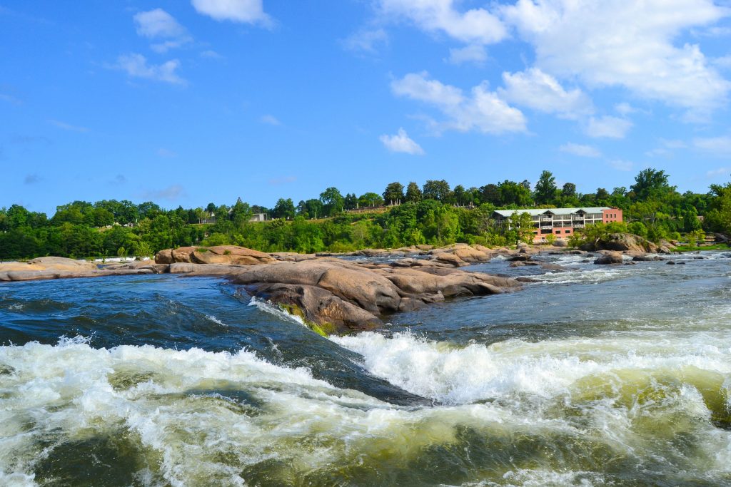 rocks, river rapids, trees on Belle Isle Beach