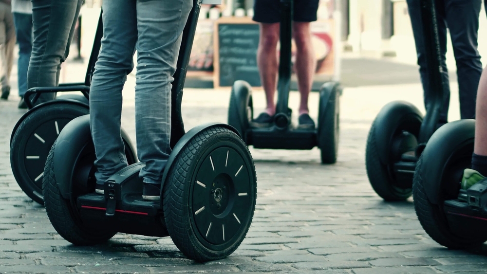 People on Segways in a town