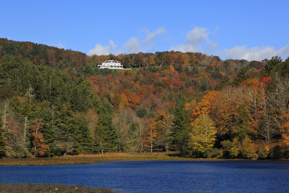 view of bass lake with moses H Cone memorial park on the hill where you can enjoy hiking in Boone