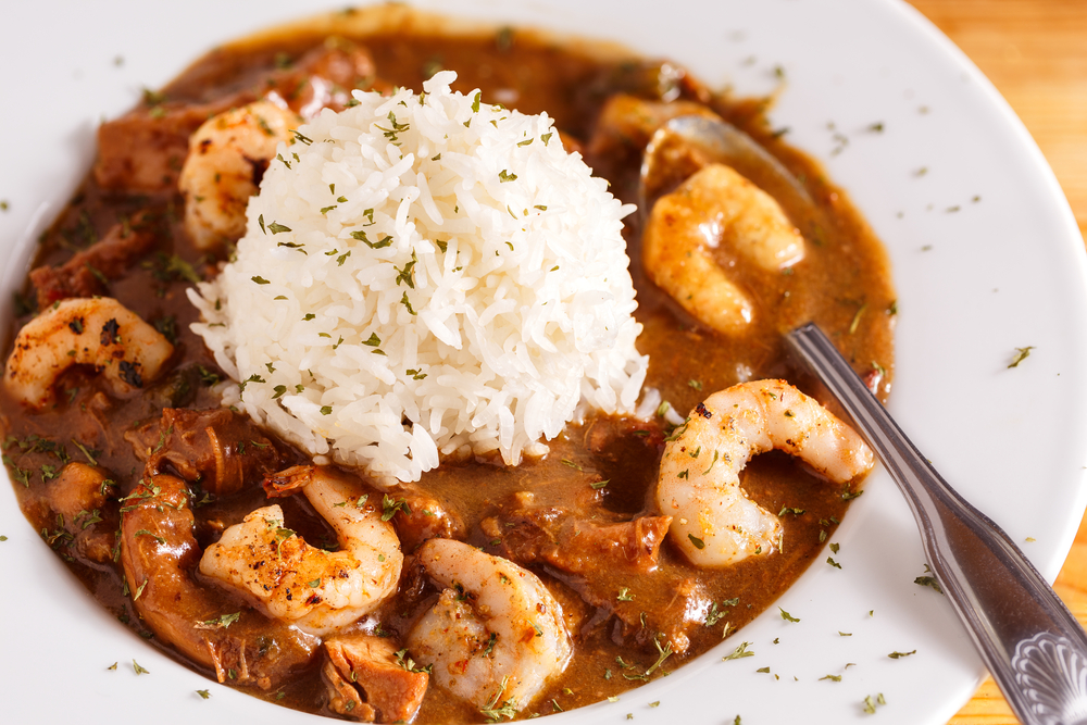 seafood gumbo with rice in a bowl with a spoon, one of the best dishes from restaurants in Beaufort