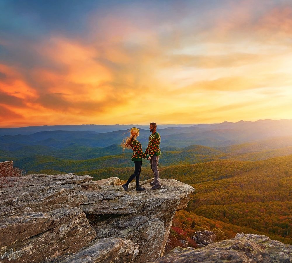 couple standing at rough ridge trail in NC on the blue ridge parkway