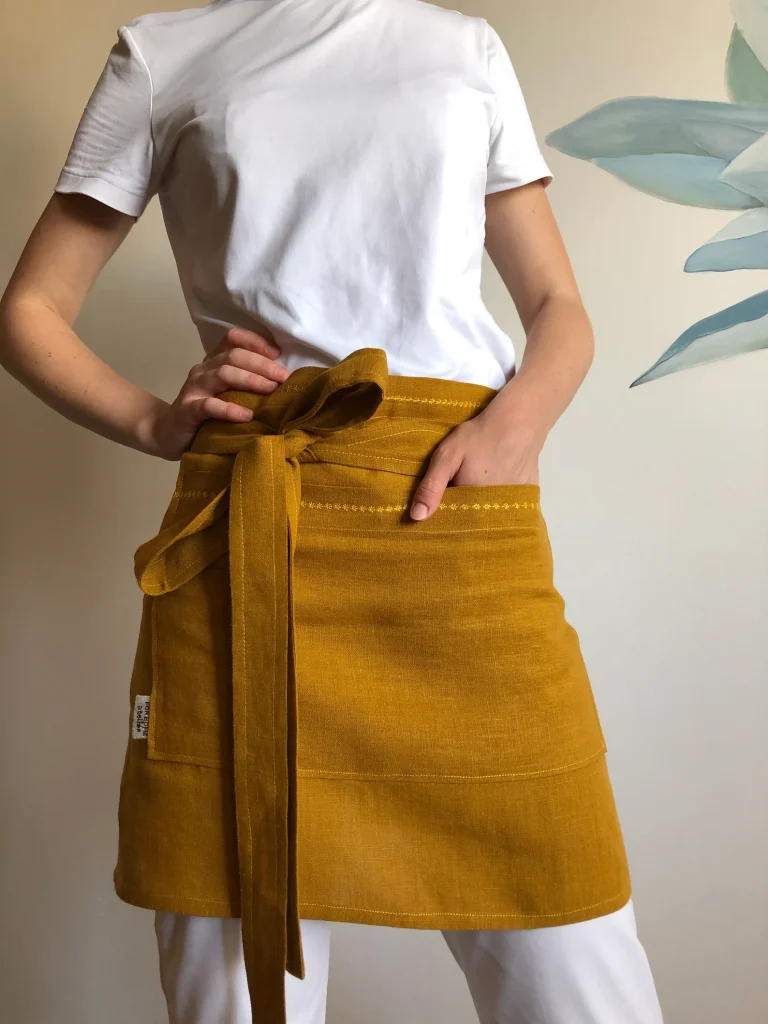 mustard colored linen apron with large front pocket