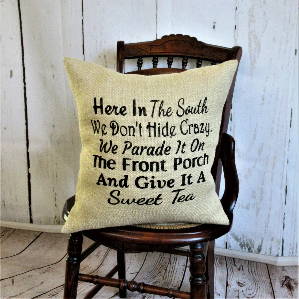 burlap pillow on wooden chair with a motto from the southern USA