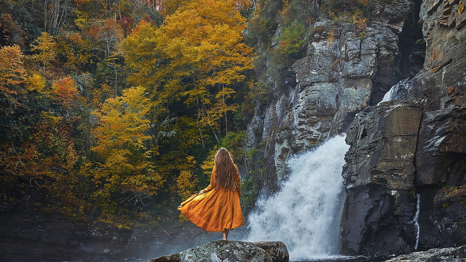 Girl in yellow dress at Linville Waterfall near Boone