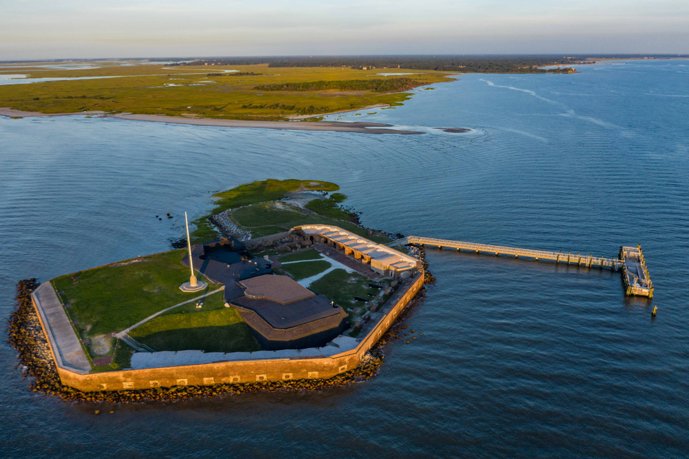 Aerial view of Fort Sumter at golden hour, one of the best places to visit in Charleston for history.
