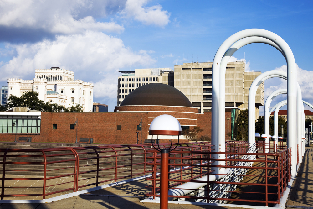 The brick building and domed ceiling of the Louisiana Art and Science Museum as can be seen from the waterfront in Baton Rouge.