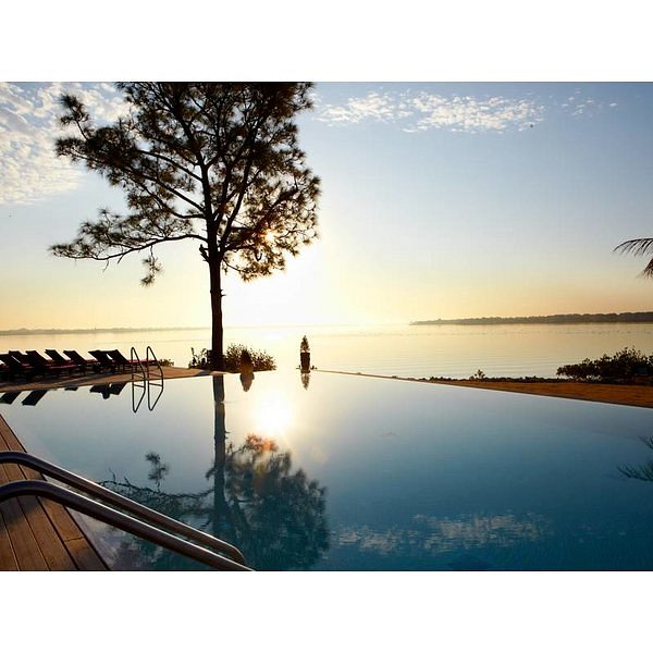 The infinity pool overlooking the lake at sunset