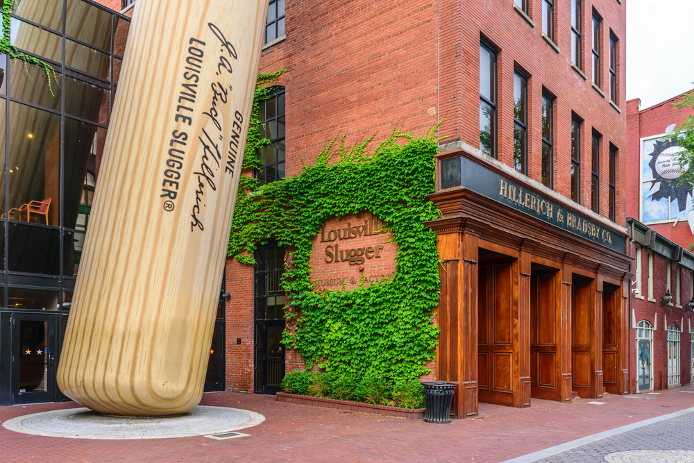 large baseball bat statue outside museum buiding