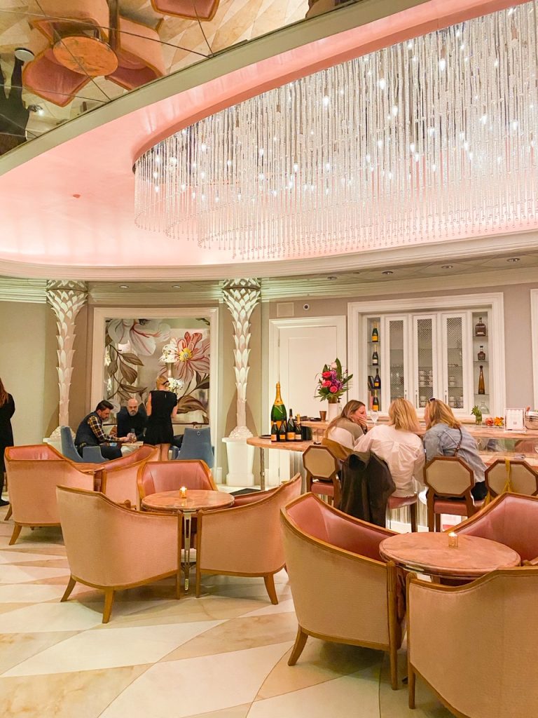 people in a pink and crystal lounge 