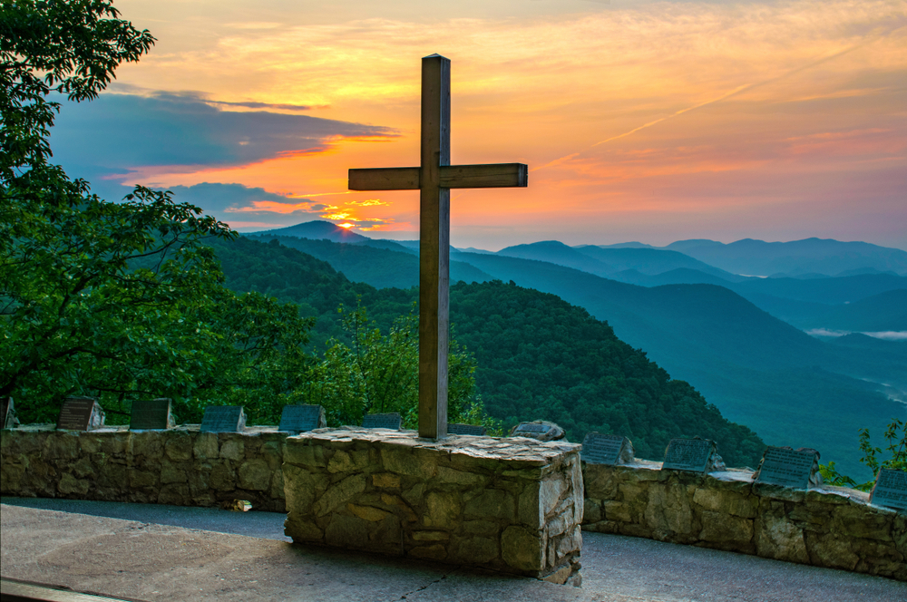 cross in front of mountains and sunset symmes chapel best places to visit in south carolina