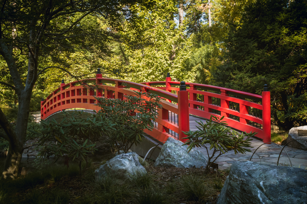 Asian themed bridge over water in one of the best best gardens in North Carolina