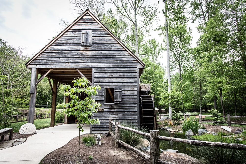 wooden building and mill in botanical garden