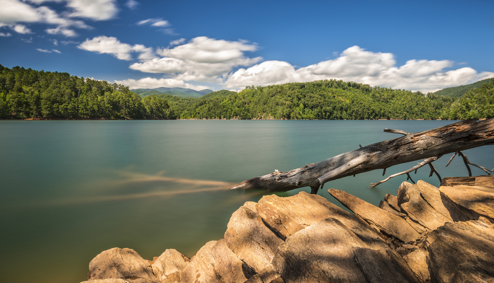 lake shore, lake view with mountains behind it