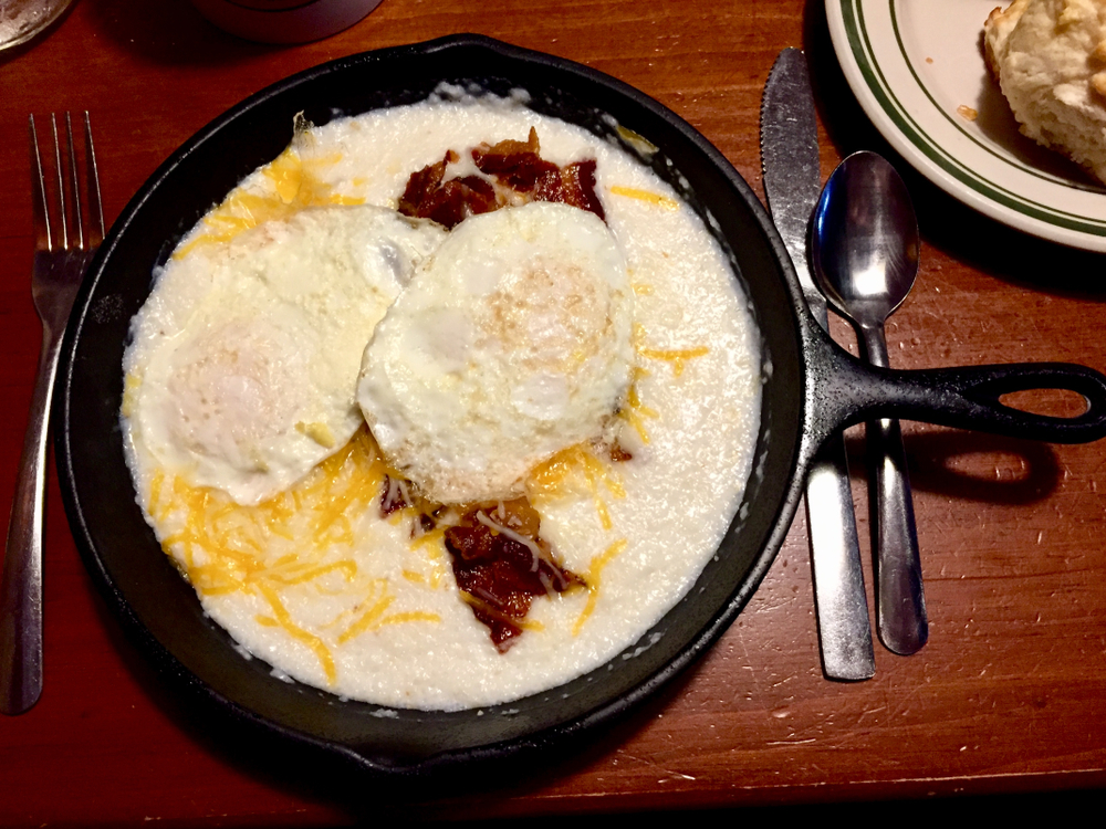 One of the breakfast skillets, full of eggs, bacon, cheese, and grits, at Flapjack's Pancake House, one of the most popular spots for breakfast in Gatlinburg.