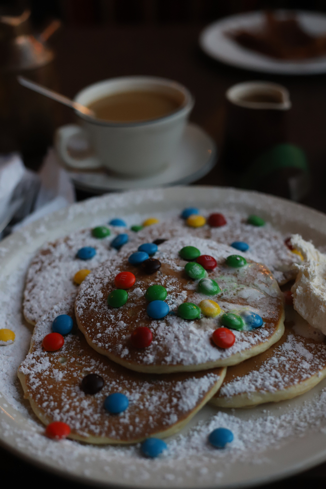 The sugar-dusted M&M pancakes at the Pancake Pantry, one of the best places for breakfast in Gatlinburg.