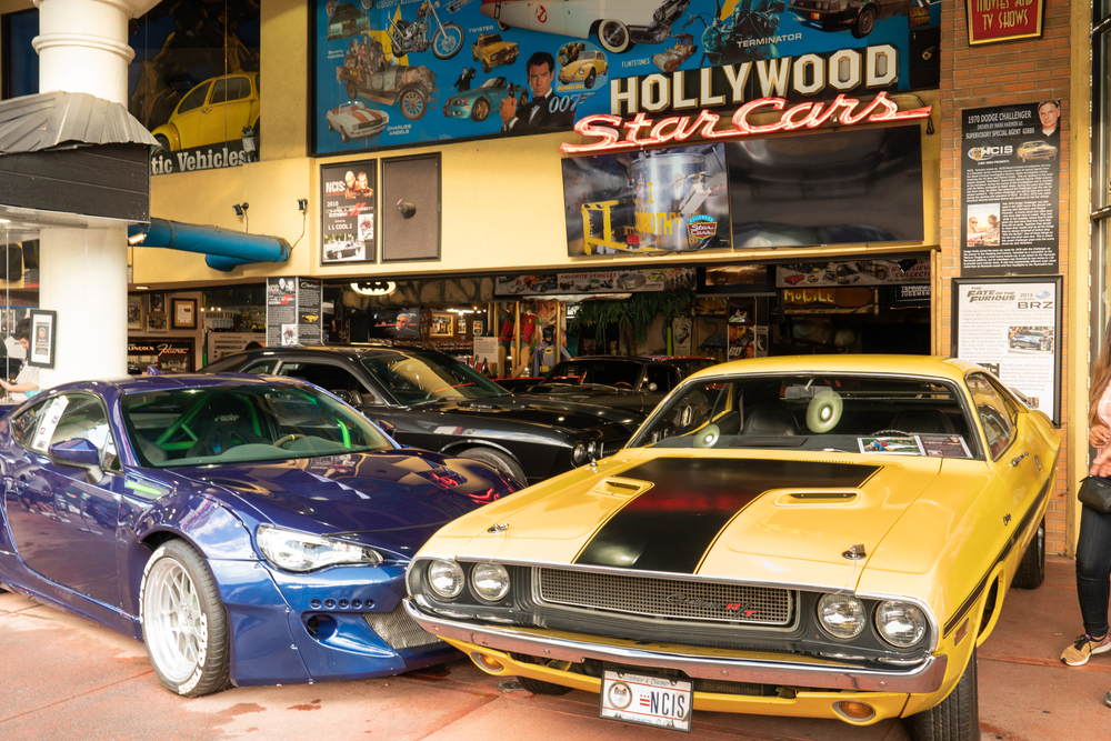 Inside the Hollywoodd Star Cars Collection featuring a 1970s yellow Dodge Challenger.