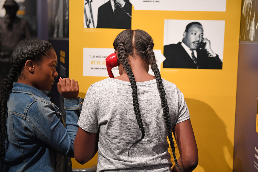 Two young girls interacting with an exhibit at an African American museum in Knoxville Tennessee. 