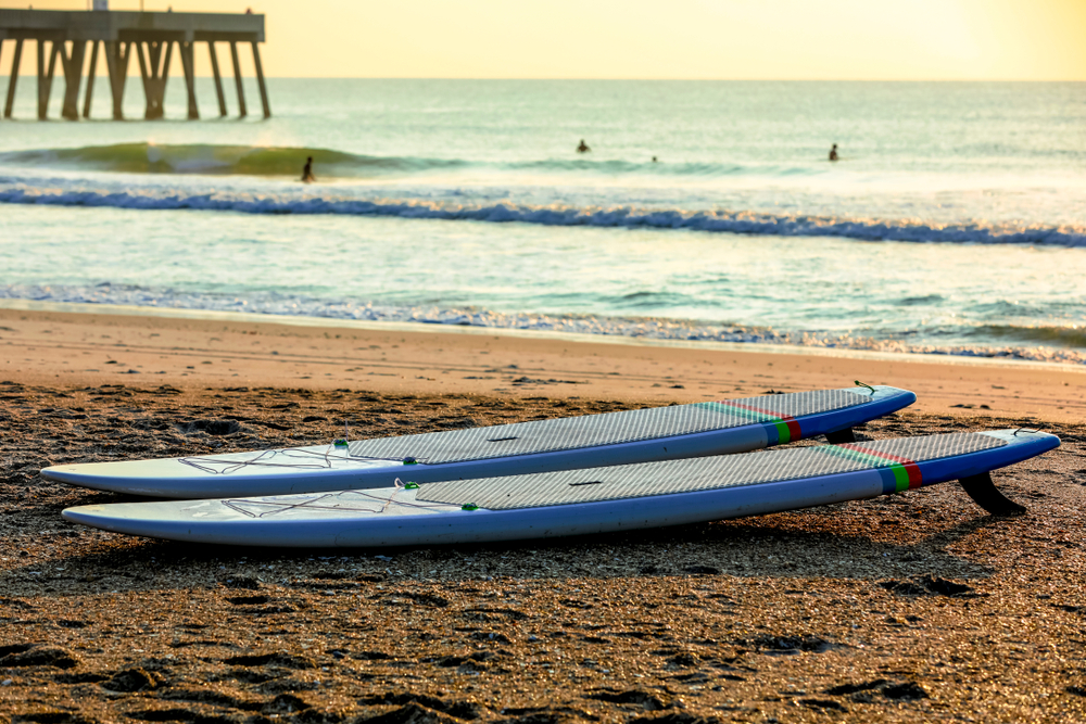 Surfboard on the sands of Wilmington beach in North Carolina.