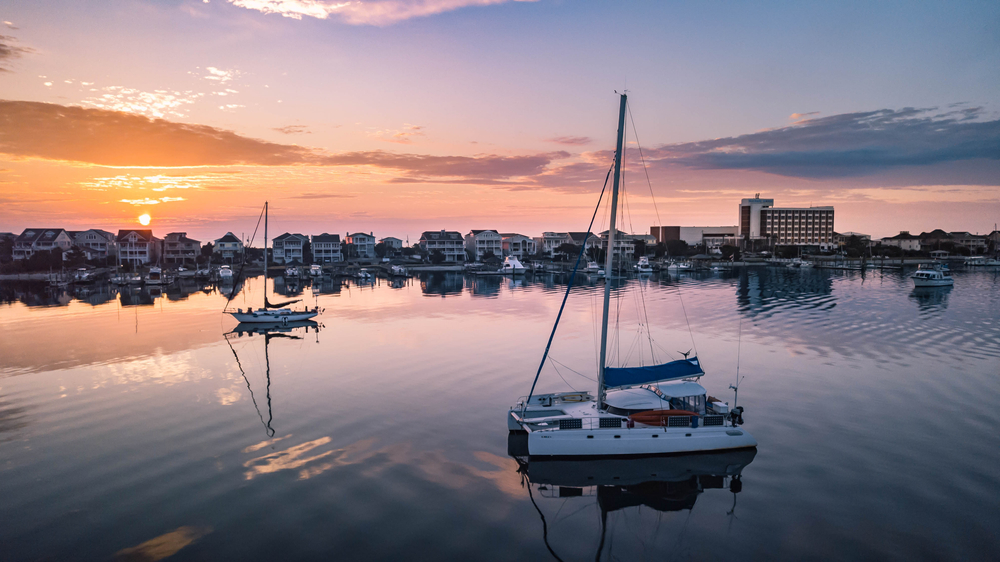 Sunrise on the water with boats at Wrightsville Beach in North Carolina. 