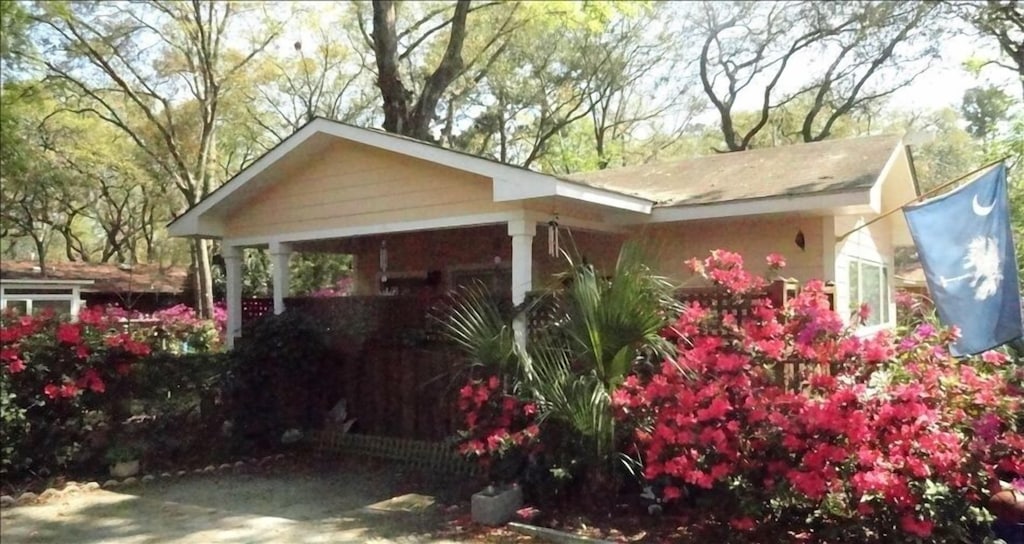 small cottage with flowers out front