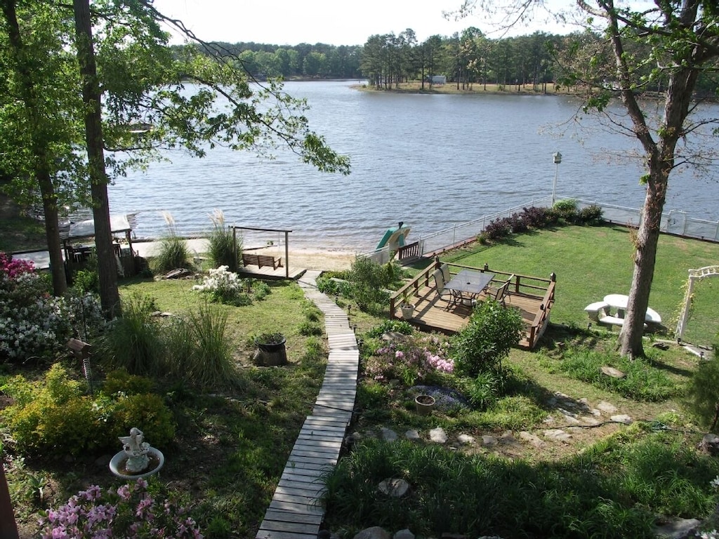 view from cabin, boardwalk, sandy beach, grassy yard