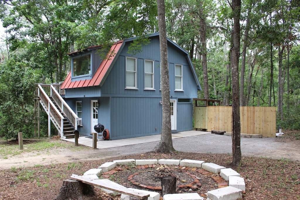 two story cabin with stairs to upper level